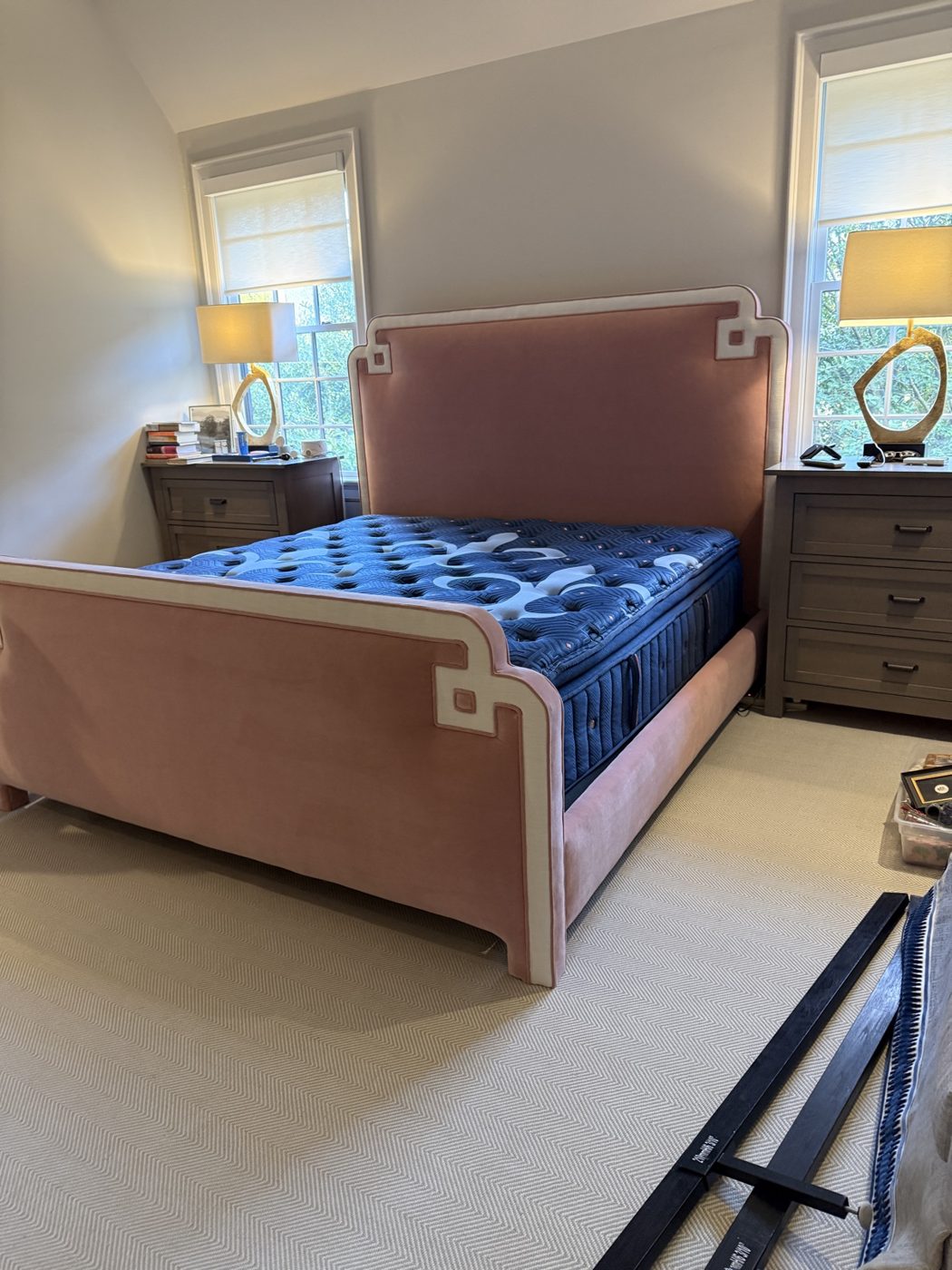 Blush velvet bed with Greek-key trim