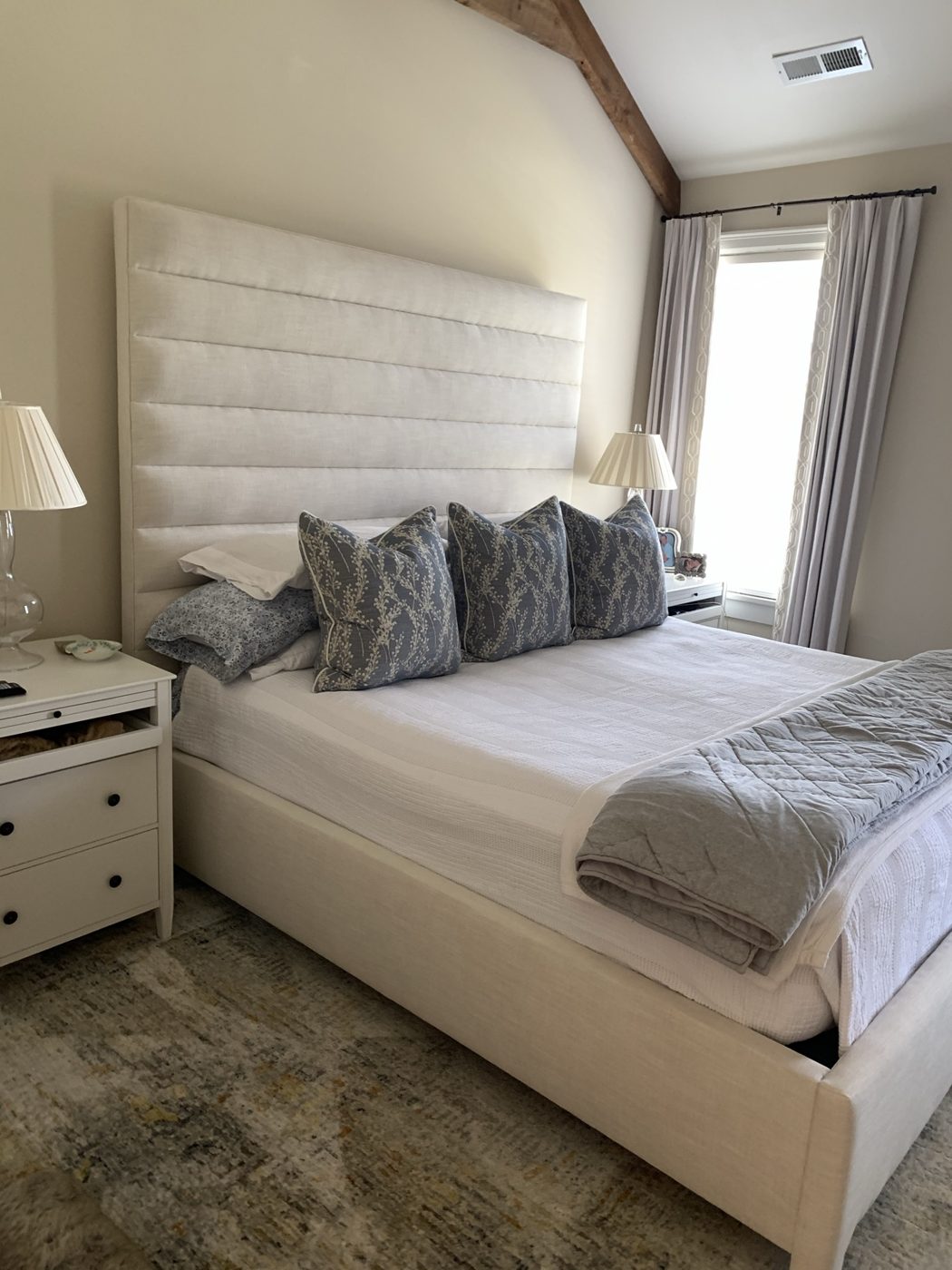 Channel-tufted tall headboard bed
