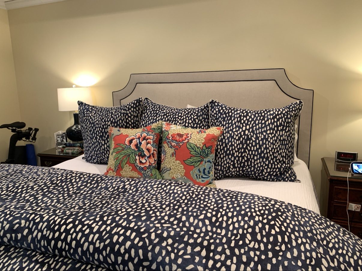 Stepped headboard bed, bold bedding