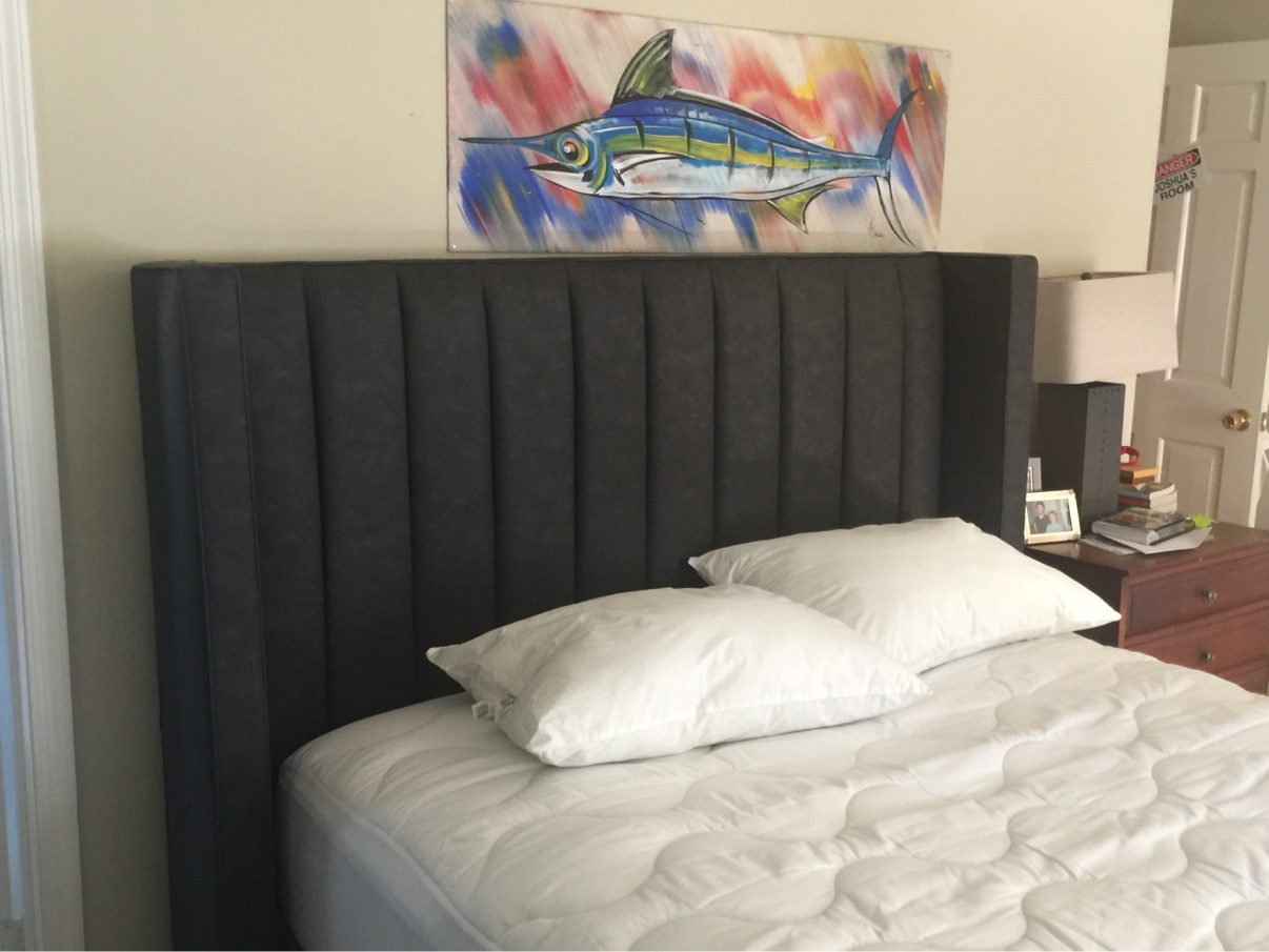Dark channel-tufted headboard bed