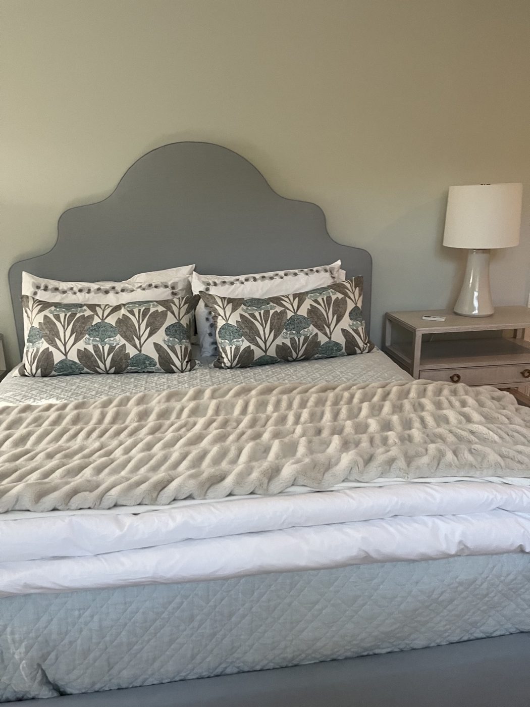Gray scalloped headboard bed