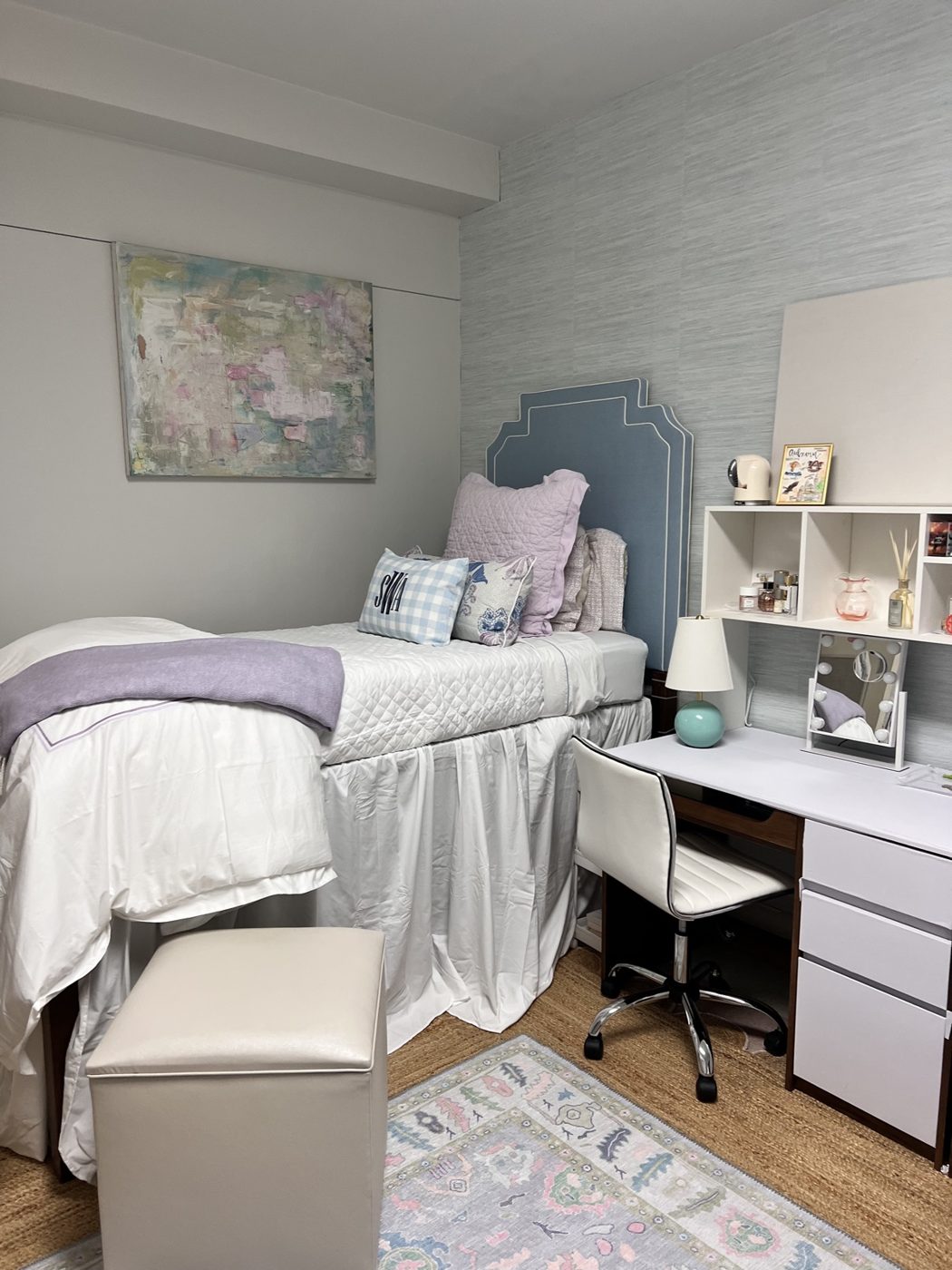 Dorm room with blue upholstered headboard