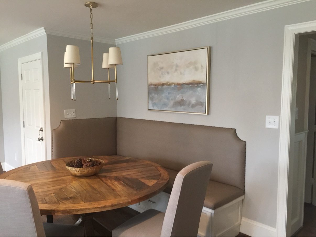 Taupe corner banquette with round table