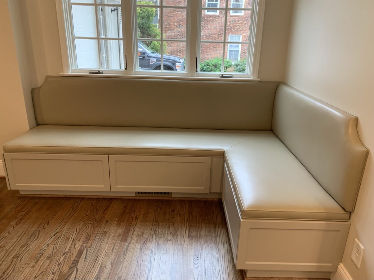 Cream leather L-banquette with storage drawers