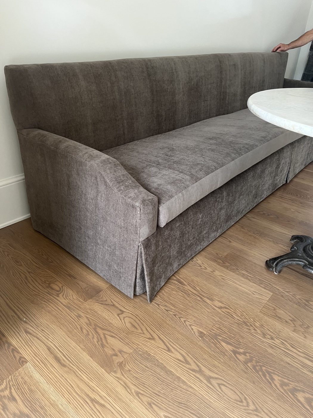 Long gray skirted banquette