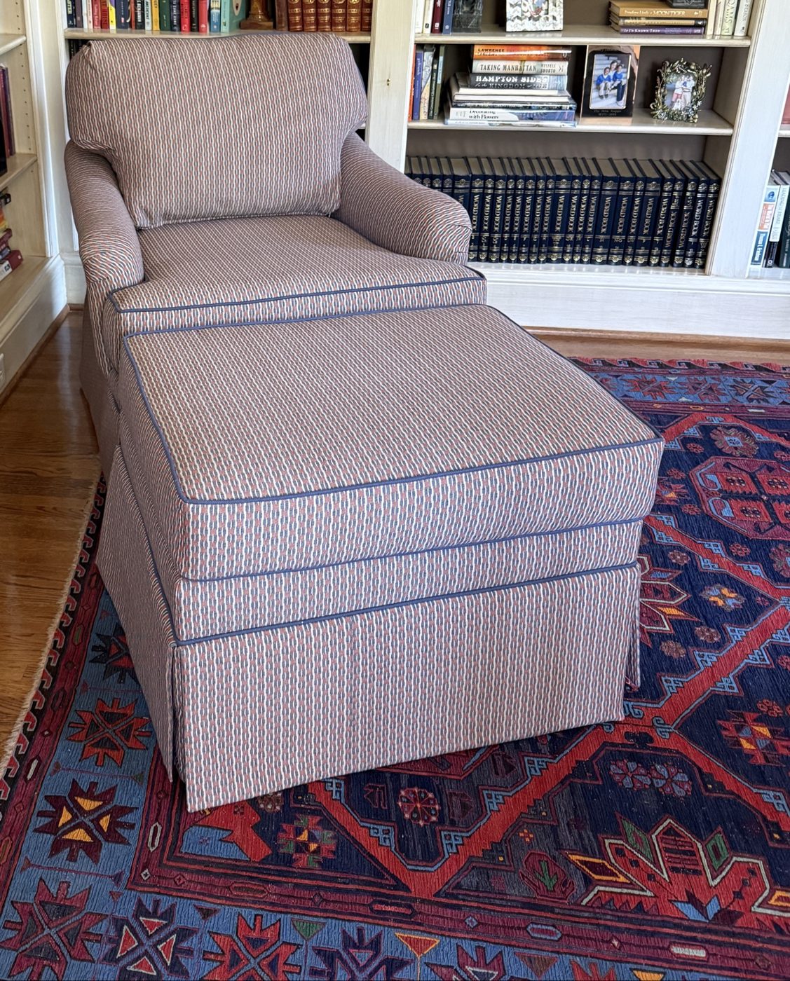 Striped armchair + ottoman in library