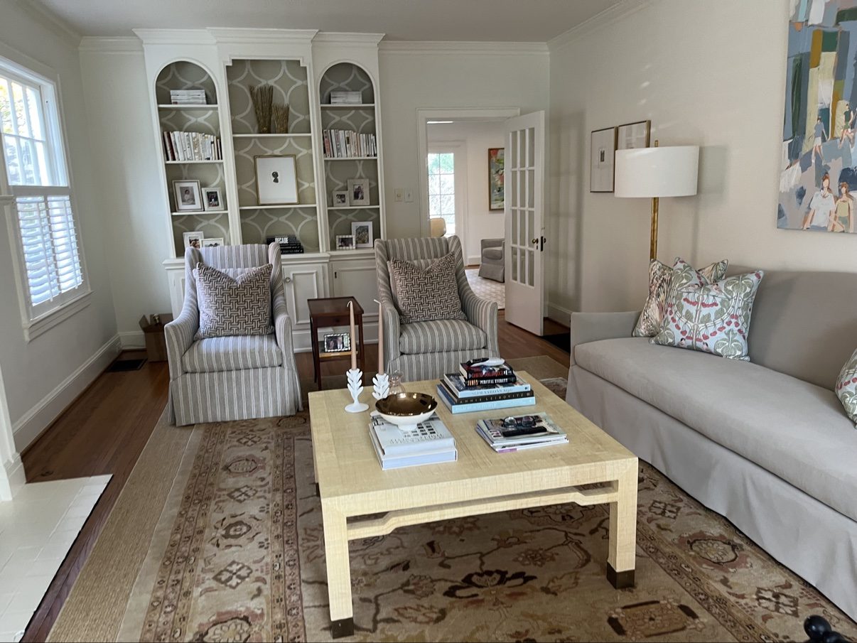 Striped skirted wing chairs + skirted sofa