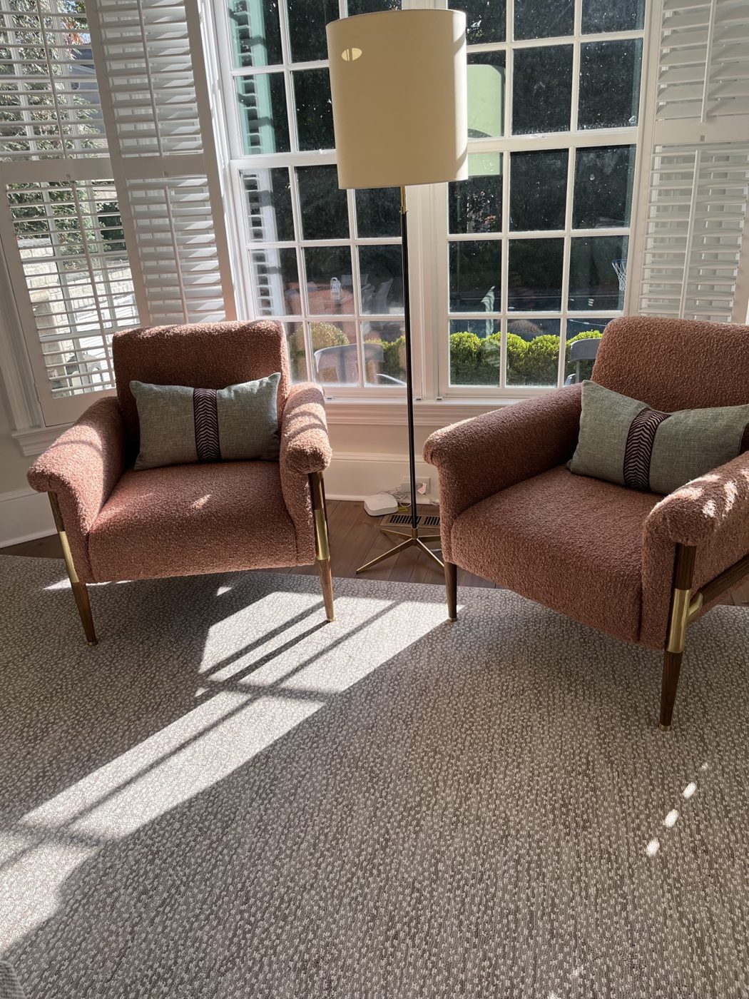 Pair of rust boucle chairs
