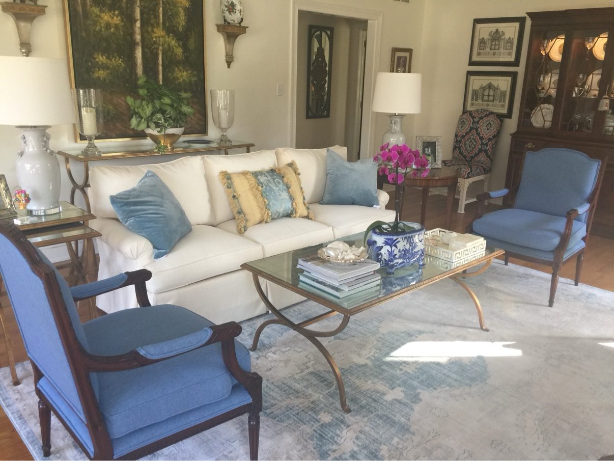 Living room with blue French chairs