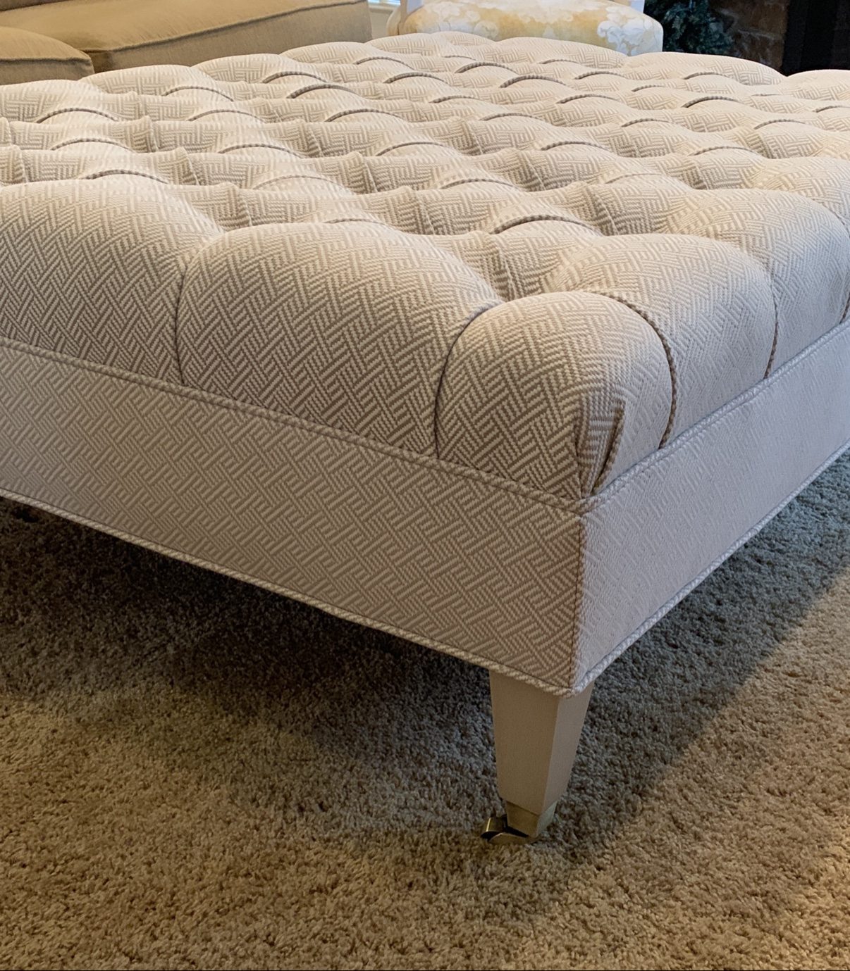 Biscuit-tufted ottoman detail