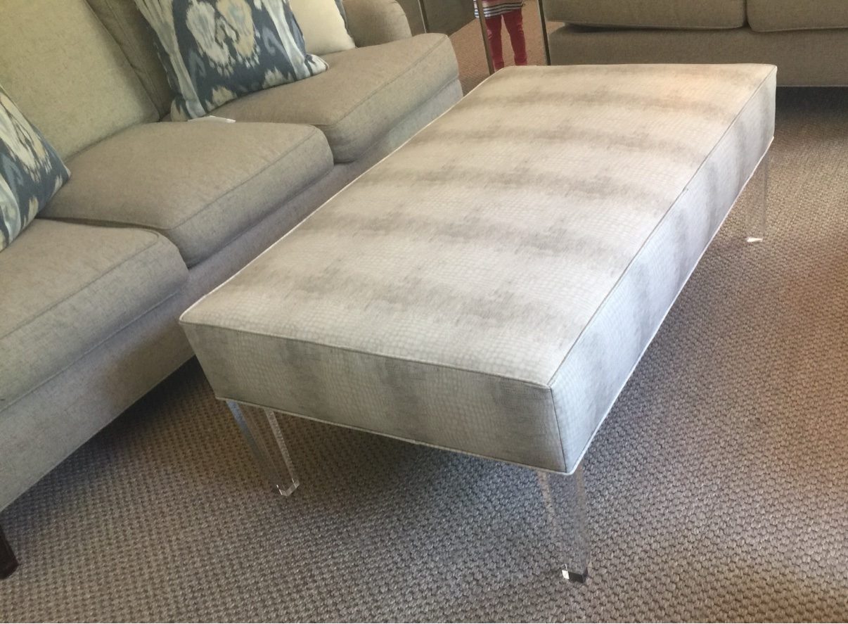 Acrylic-leg upholstered ottoman