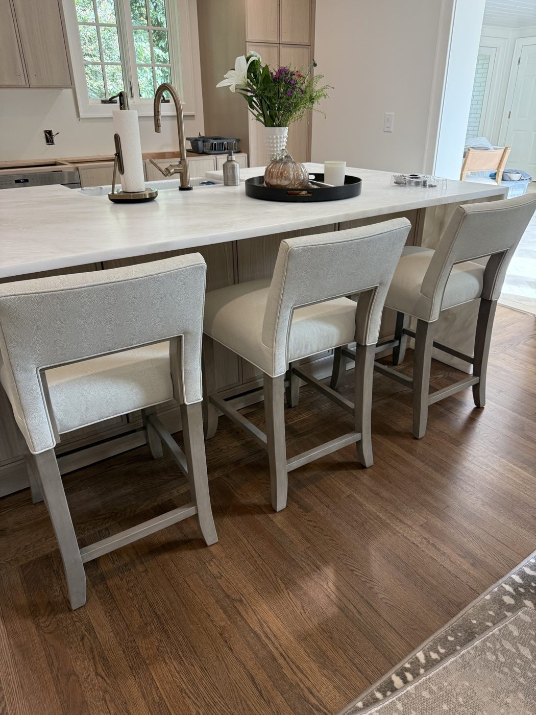 Cream counter stools at kitchen island