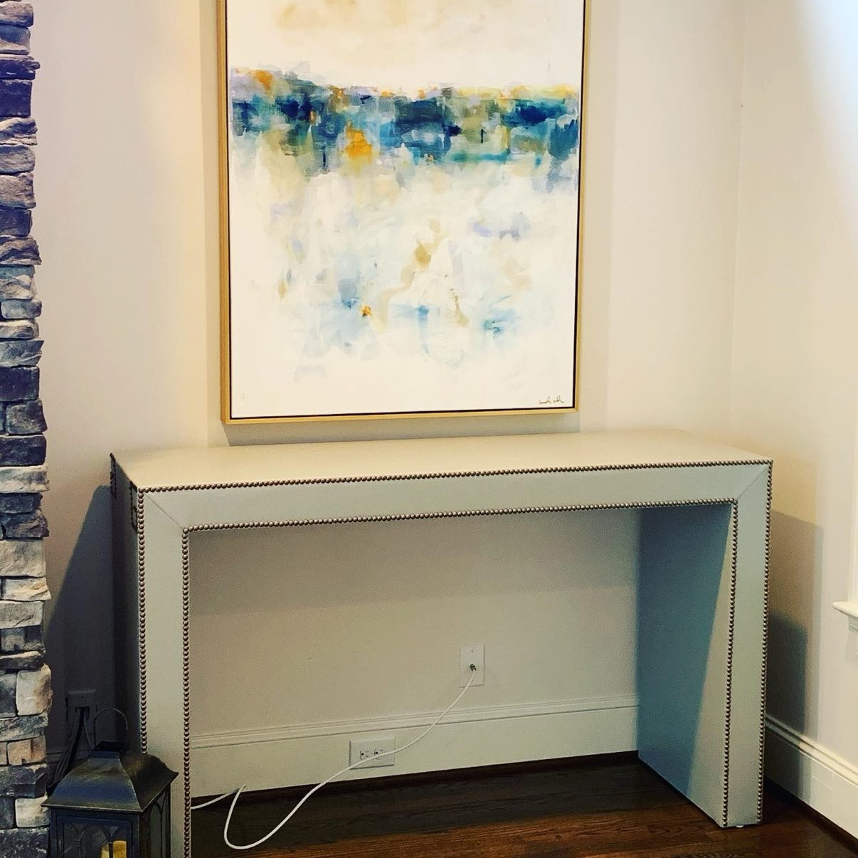 Console under abstract painting