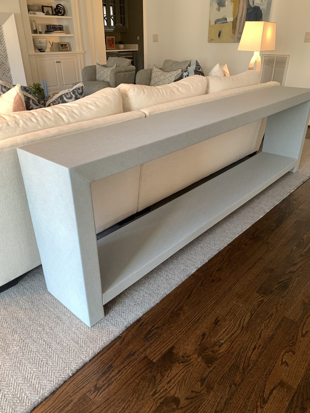 Long console behind sofa