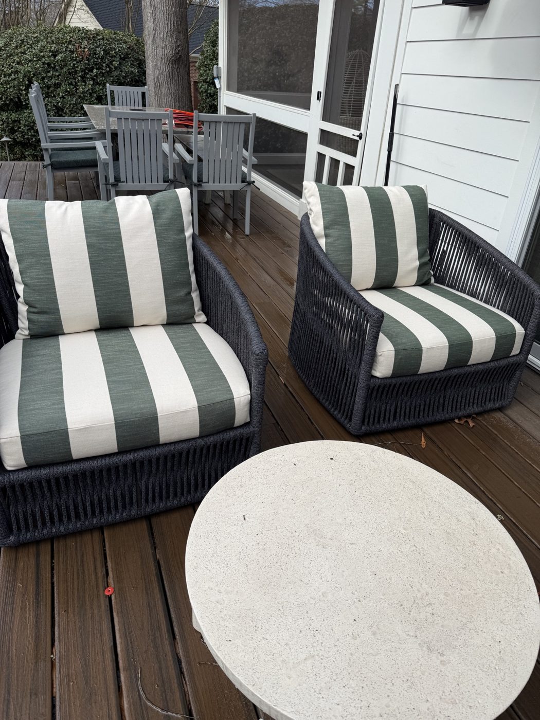 Wicker chairs with green-white striped cushions