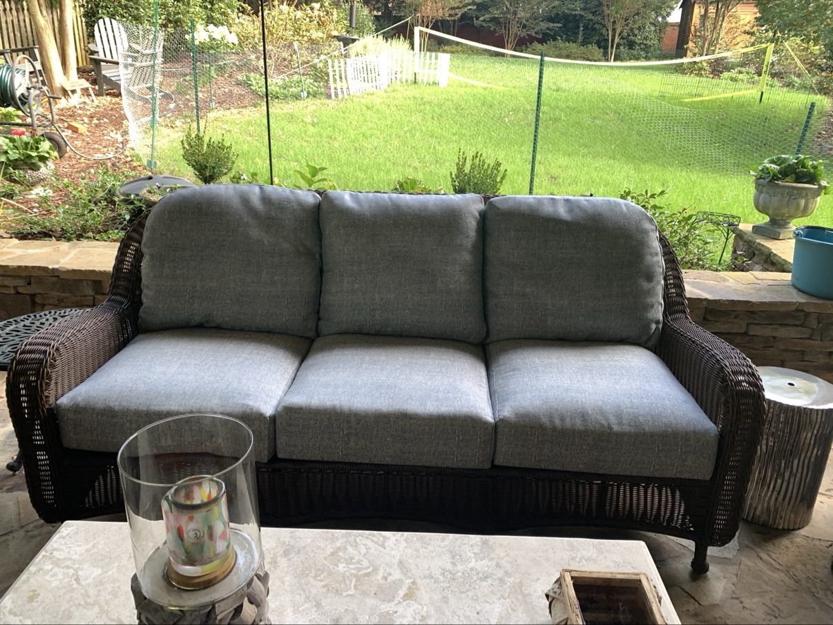 Wicker sofa with gray cushions