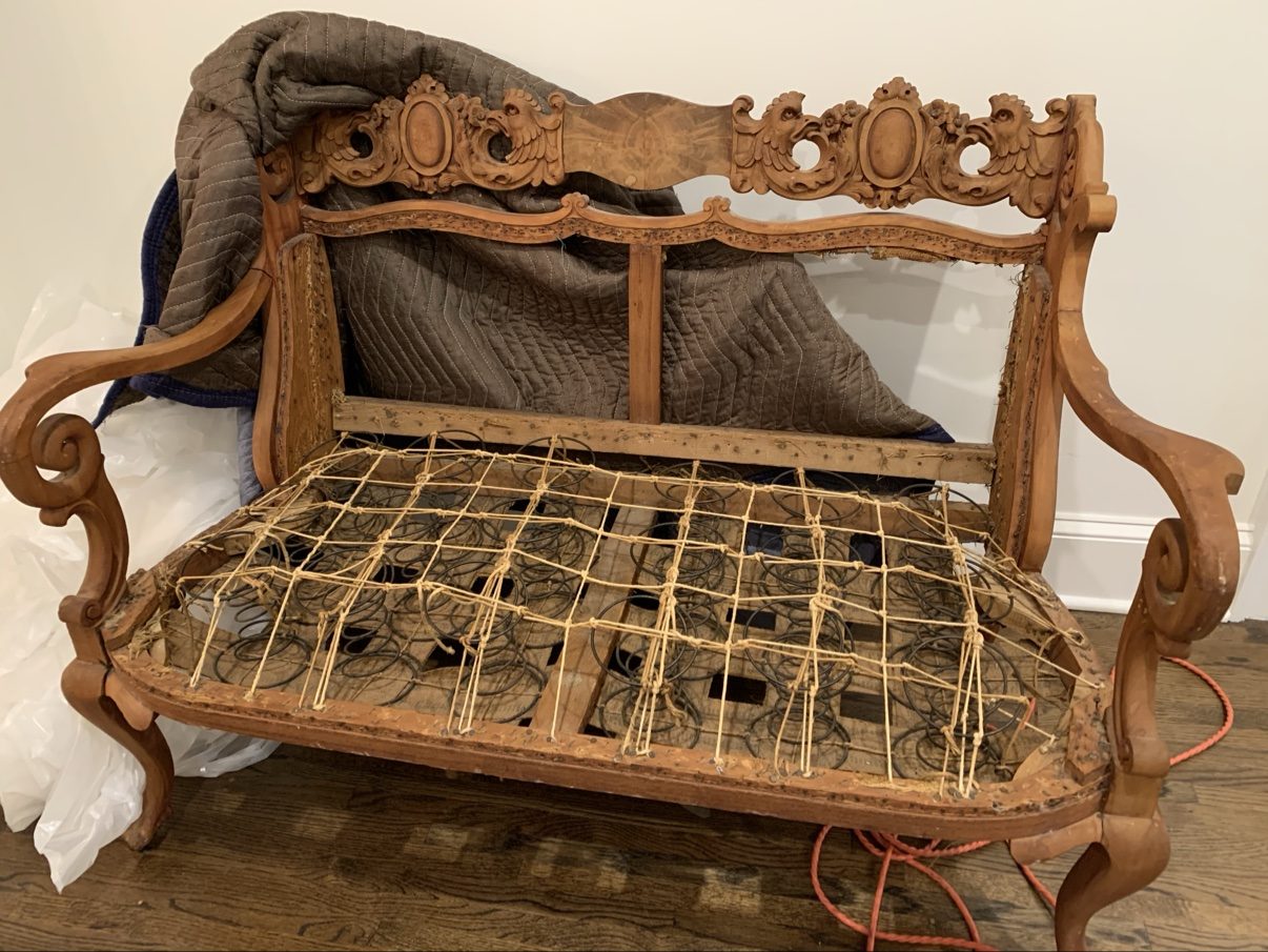 Stripped antique settee frame (before)