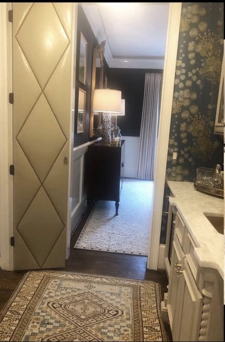 Diamond-nailhead upholstered door, installed, hallway view